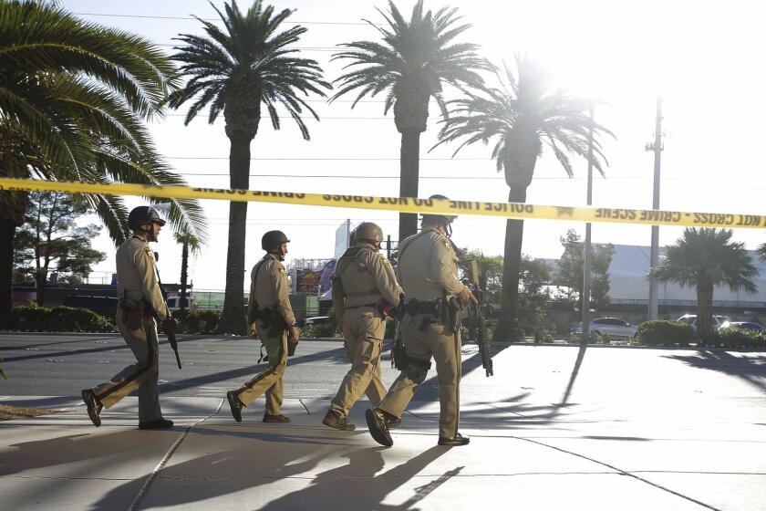Mandatory Credit: Photo by PAUL BUCK/EPA-EFE/REX/Shutterstock (9106426y) Heavily armed police outside the Mandalay Bay hotel near the scene of the mass shooting at the Route 91 Harvest festival on Las Vegas Boulevard in Las Vegas, Nevada, USA, 02 October, 2017. Police reports indicate that a gunman firing from an upper floor in the Mandalay Bay hotel killed more than 50 people and injured more than 500 before he reportedly killed himself as police made their way to his hotel room. Route 91 Harvest festival shooting, Las Vegas, USA - 02 Oct 2017 ** Usable by LA, CT and MoD ONLY **