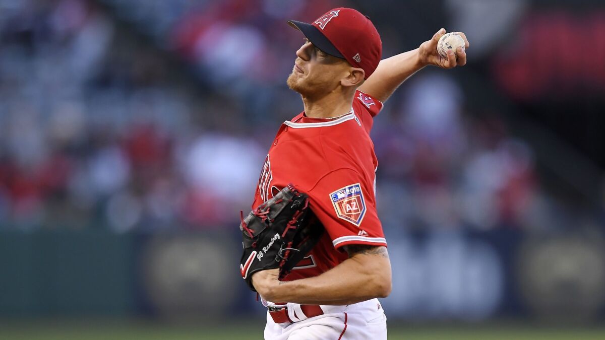 Parker Bridwell pitches for the Angels during a spring training baseball game against the Dodgers on March 25.