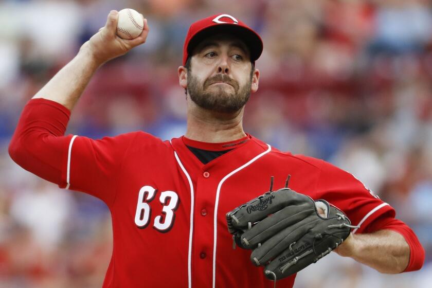 Cincinnati Reds relief pitcher Dylan Floro throws in the ninth inning of a baseball game against the Chicago Cubs, Saturday, June 23, 2018, in Cincinnati. (AP Photo/John Minchillo)