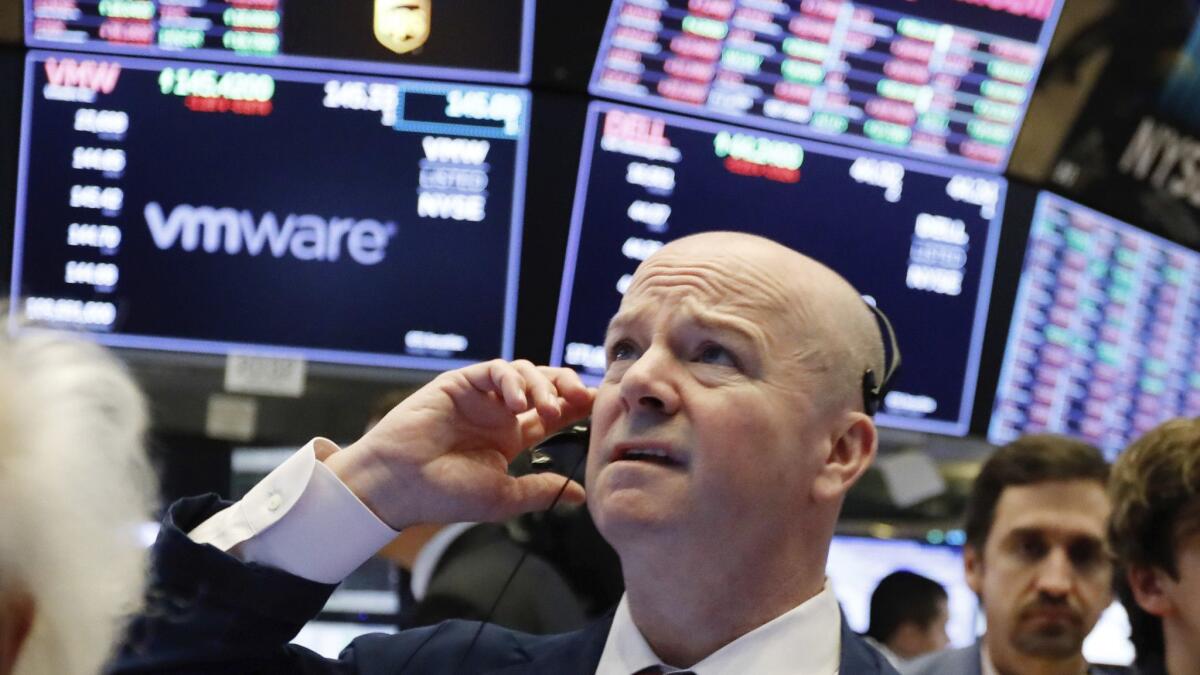 Trader Patrick Casey works on the floor of the New York Stock Exchange on Monday.