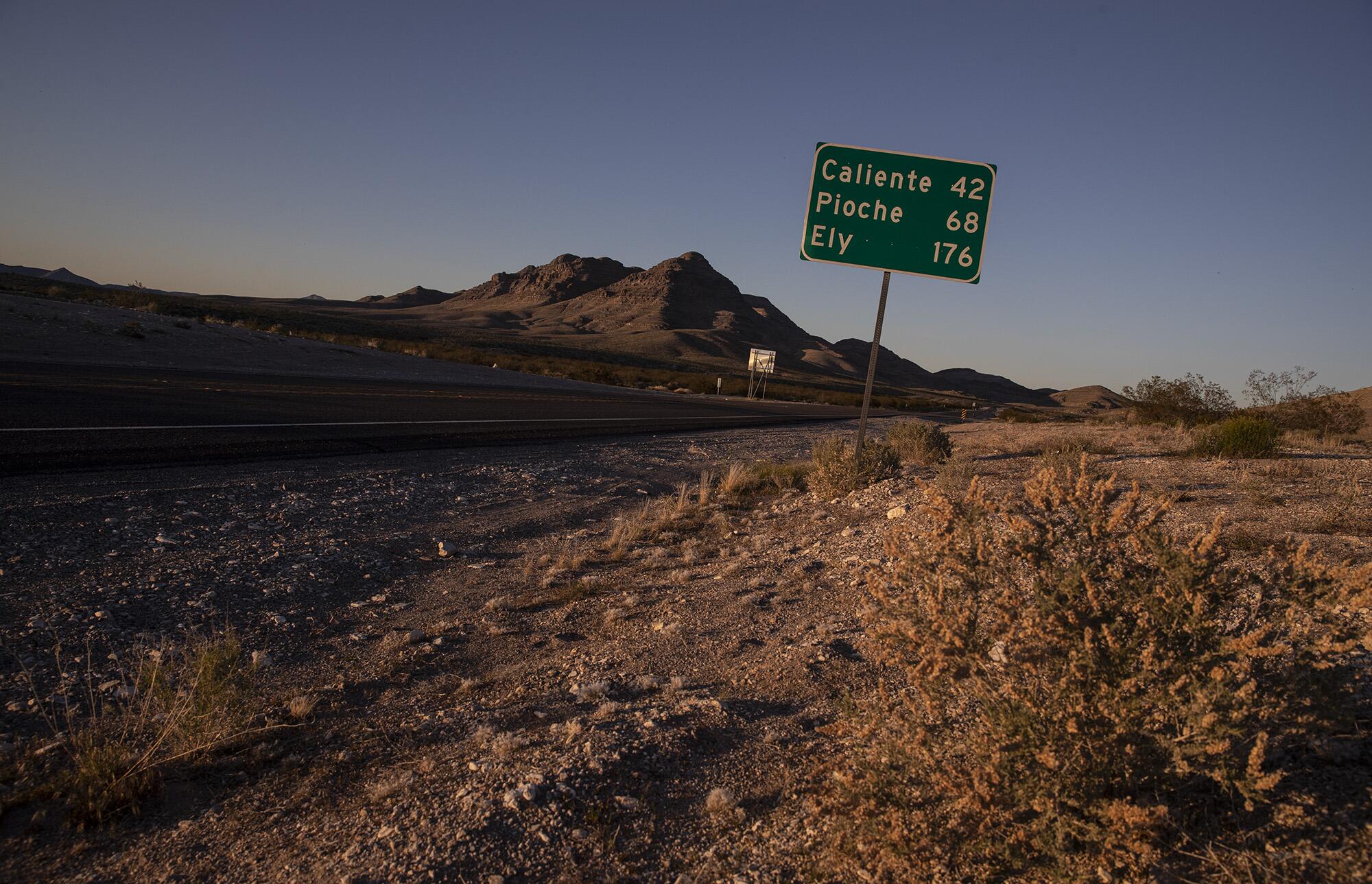 A road sign along Highway 93 previews the small rural towns ahead as the highway weaves north through Lincoln County in Hiko, Nevada. 