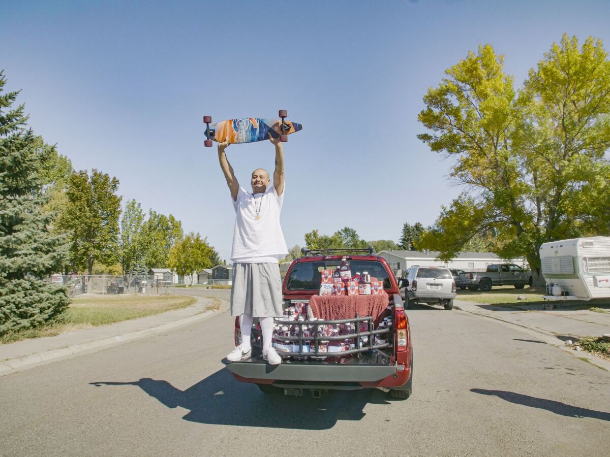 Nathan Apodaca on the back of his new truck.