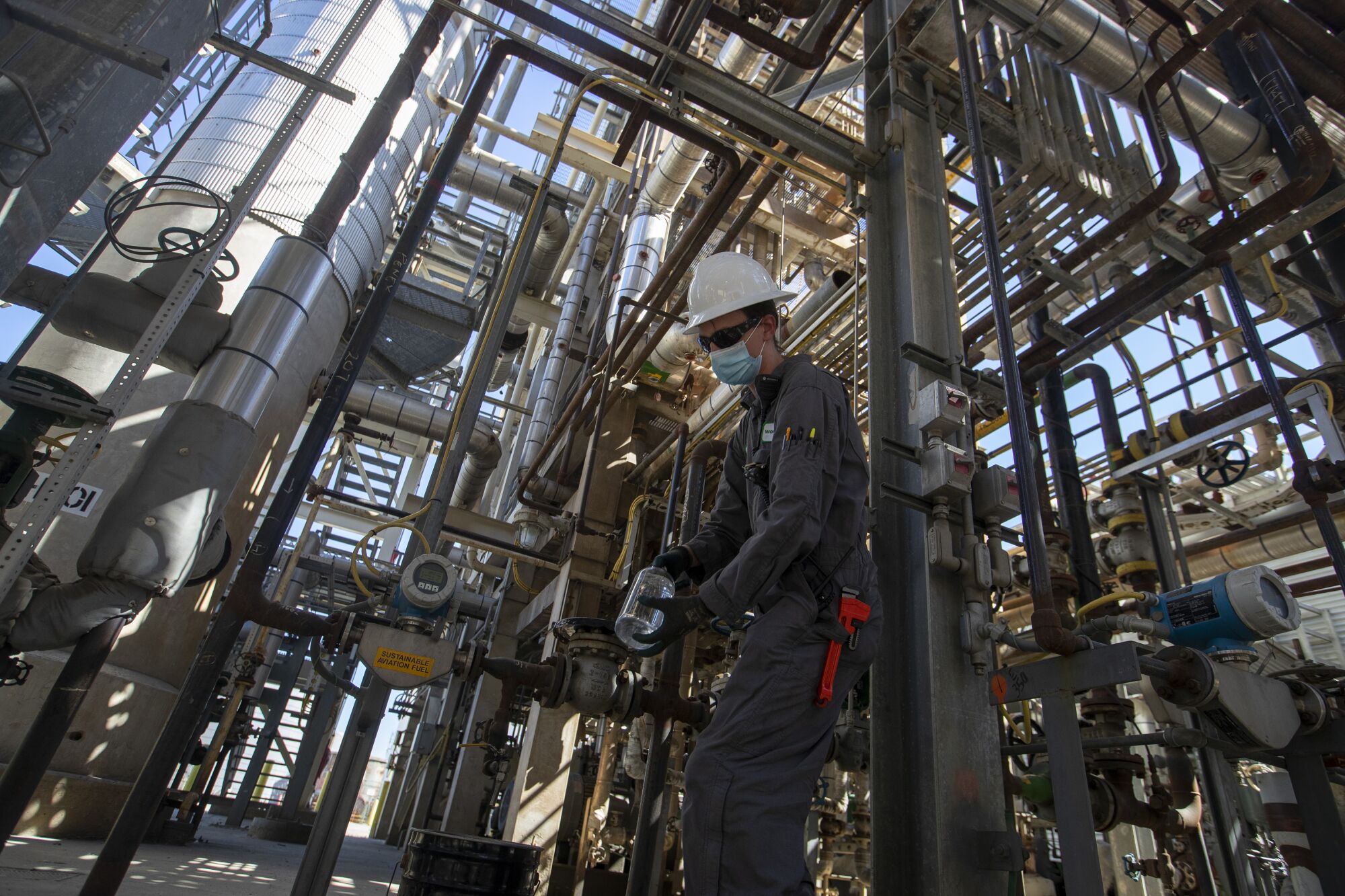 Operator holds a jar of Jet-A fuel