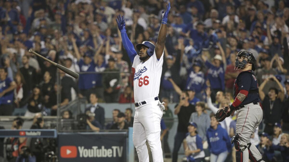 Dodgers' Yasiel Puig watches his three-run home run against the Boston Red Sox during Game 4 of the World Series.