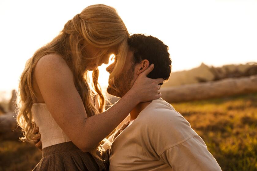 Abigail Cowen as Angel and Tom Lewis as Michael Hosea in the 2022 drama “Redeeming Love.”