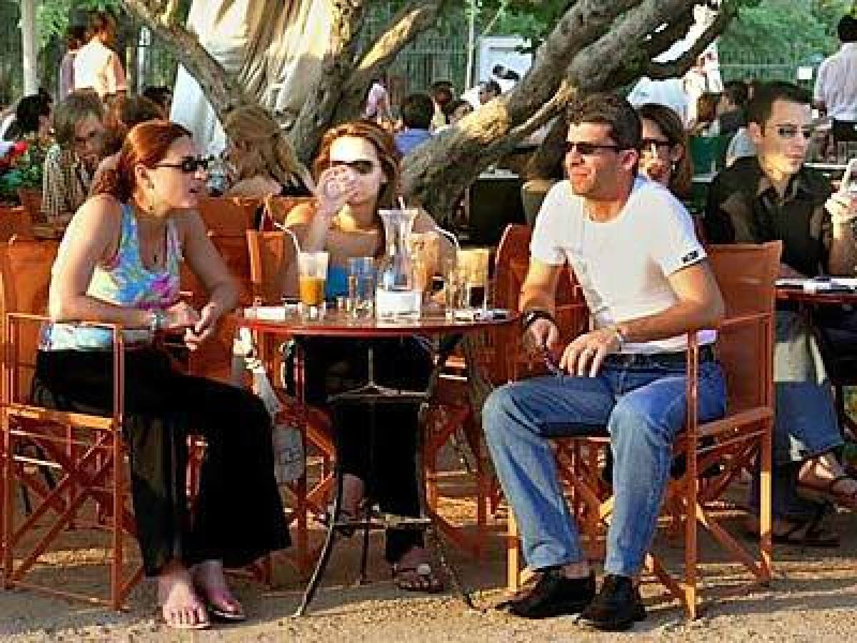 In Athens, diners choose frappés me gala (with milk), left, and horis gala (without milk), right.