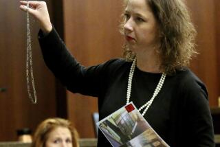 FILE - Brunswick Judicial Circuit District Attorney Jackie Johnson presents her closing arguments during the trial of De'Marquise Elkins and Karimah Elkins at Cobb Superior Court in Marietta, Ga., Aug. 2013. (AP Photo/Atlanta Journal-Constitution, Phil Skinner, File)