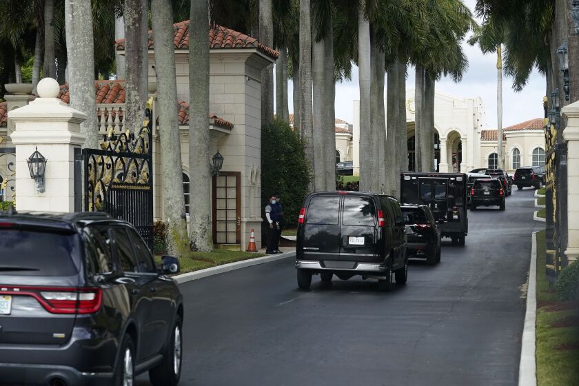 President Donald Trump's motorcade arrives at Trump International Golf Club, Thursday, Dec. 24, 2020, in West Palm Beach, Fla. (AP Photo/Patrick Semansky)