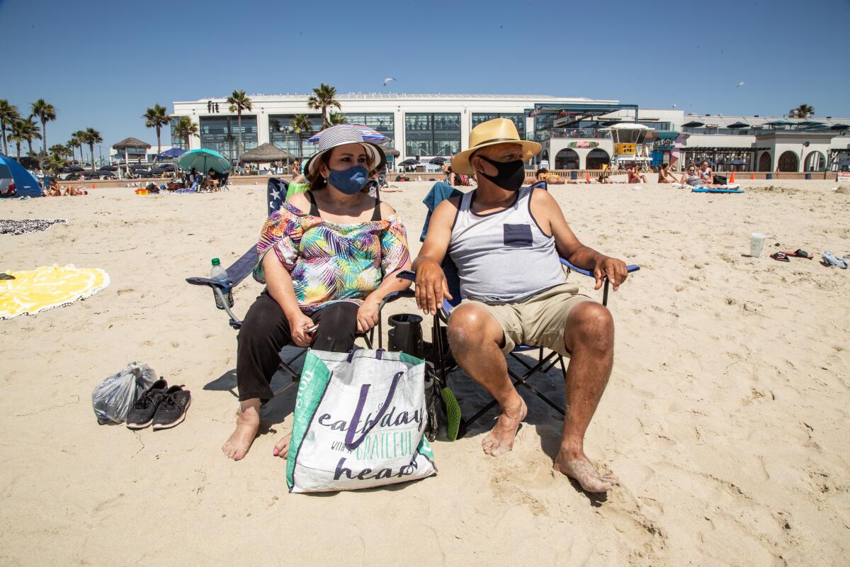 Angelica and Julio Rascon of Tucson visit Mission Beach on Friday. 