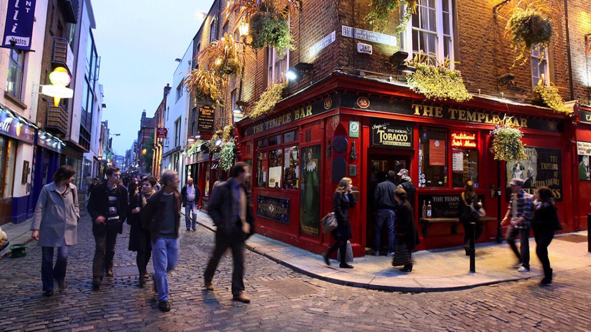 Pedestrians stroll the Temple Bar pub in Dublin, Ireland. Ethiopian Airlines is offering a round-trip fare from LAX to Dublin for under $600.