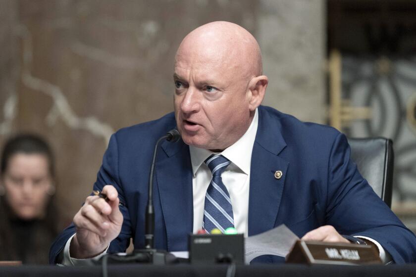 Sen. Mark Kelly, D-Ariz., speaks during a hearing of the Senate Armed Services Committee to examine the posture of United States Northern Command and United States Southern Command, on Capitol Hill, in Washington, Thursday, March 24, 2022. (AP Photo/Jose Luis Magana)