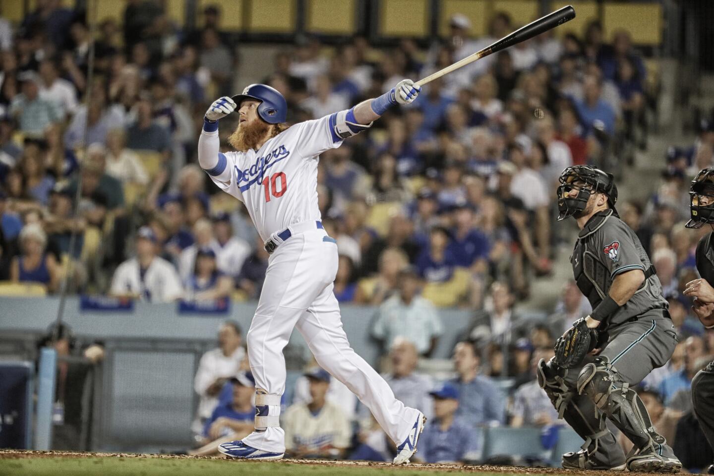 Los Angeles Dodgers' Yasiel Puig waits for his turn to bat with