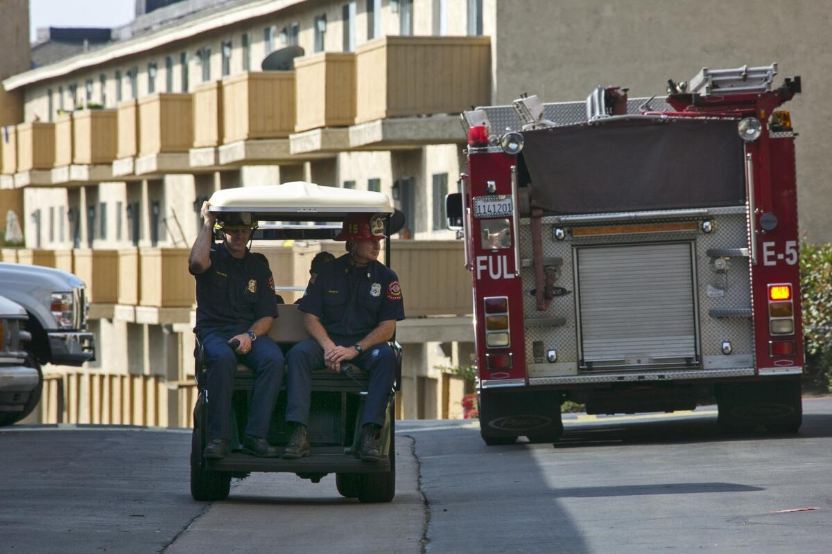 The Fullerton Fire Department checks for damage to an apartment complex on the 2600 block of Associated Road in Fullerton after Friday's 5.1 earthquake.