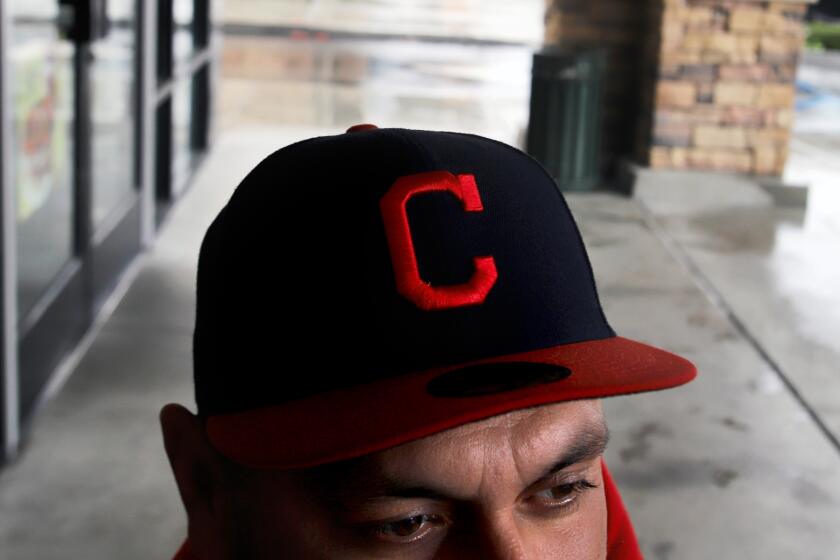 Cesar Hernandez, 37, wearing the the letter "C" for Cesar, poses outside of a Starbucks in Moreno Valley on Wednesday, March 29, 2023. Cesar Hernandez is a plaintiff in a lawsuit against the GEO Group, a for-profit immigrant detention center that used disinfect chemicals during the Covid 19 pandemic. Hernandez and others who were detained there now complain of symptoms of vomiting, headaches, nose bleeds and dizziness. (Photo by James Carbone for the Los Angeles Times Espanol)