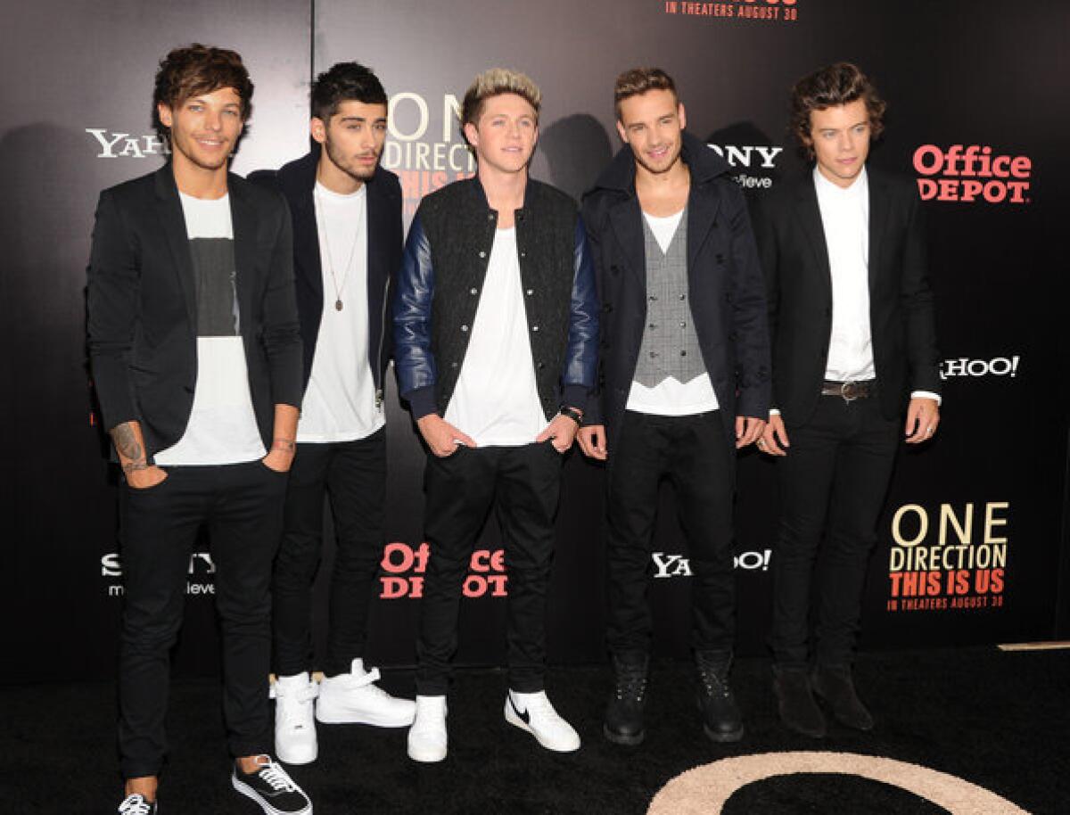British boy band One Direction, from left, Louis Tomlinson, Zayn Malik, Niall Horan, Liam Payne and Harry Styles, attend the premiere of "One Direction: This Is Us" in New York.