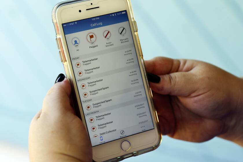 FILE - This Aug. 1, 2017, file photo, shows a call log displayed via an AT&T app on a cellphone in Orlando, Fla. Industry experts say robocalls are down — scam calls as well as nagging from your credit-card company to pay your bill. The coronavirus pandemic has inflicted millions of job losses, and scammers have not been immune. YouMail, which offers a robocall-blocking service, says 2.9 billion robocalls were placed in April 2020 in the U.S., down from 4.1 billion in March and 4.8 billion in February. (AP Photo/John Raoux, File)