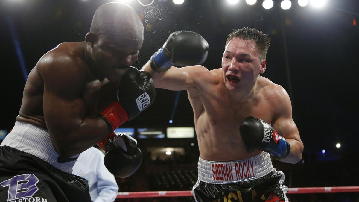 Ruslan Provodnikov, right, delivers a punch to the head of Timothy Bradley during their bout in Carson in March 2013.