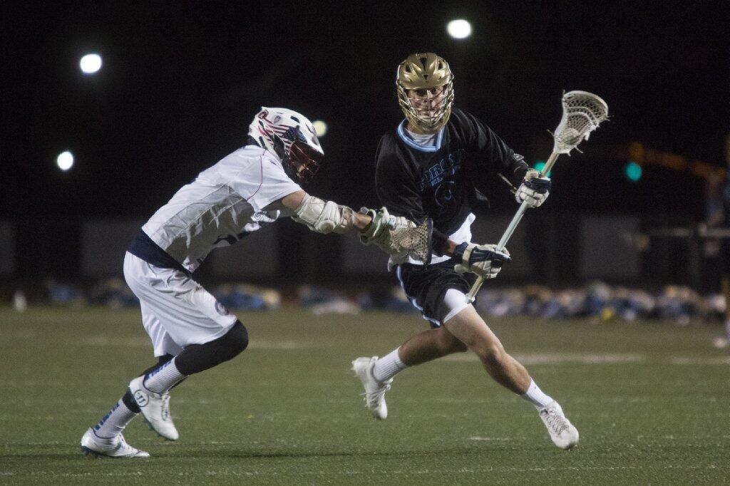 Corona del Mar's Bobby Purciful, right, advances past Newport Harbor's defense and scores during the Battle of the Bay.