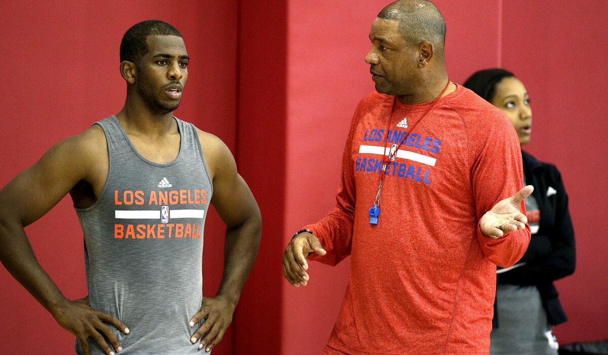 Clippers Coach Doc Rivers talks to point guard Chris Paul during practice last week in Las Vegas.