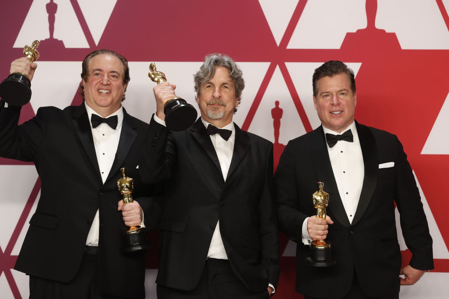 Nick Vallelonga, left, Peter Farrelly and Brian Currie, winners of the original screenplay award for "Green Book."