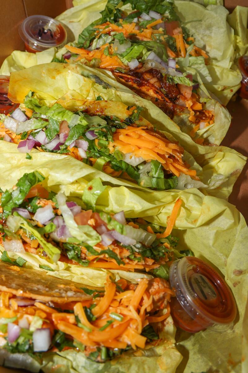 A fresh batch of tacos from Worldwide Taco, seasoned and ready to go.