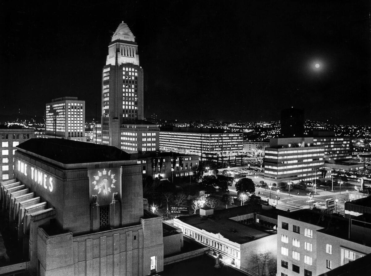 Feb. 4, 1969: Los Angeles City Hall and Los Angeles Times building at night. A full moon is on the right. Photo taken from the Los Angeles Times Mirror building.