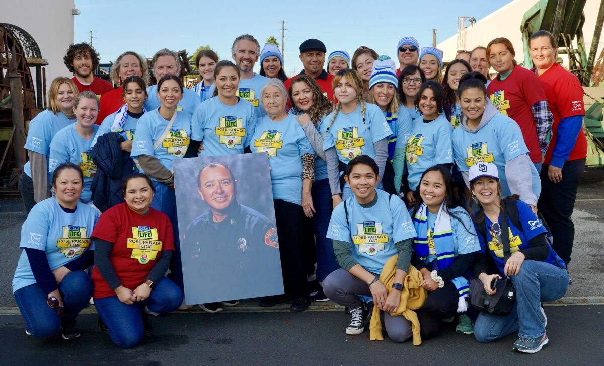 Group photo of staff members from Lifesharing and UC San Diego Health, joined by the family of Capt. Robin Cervantes.