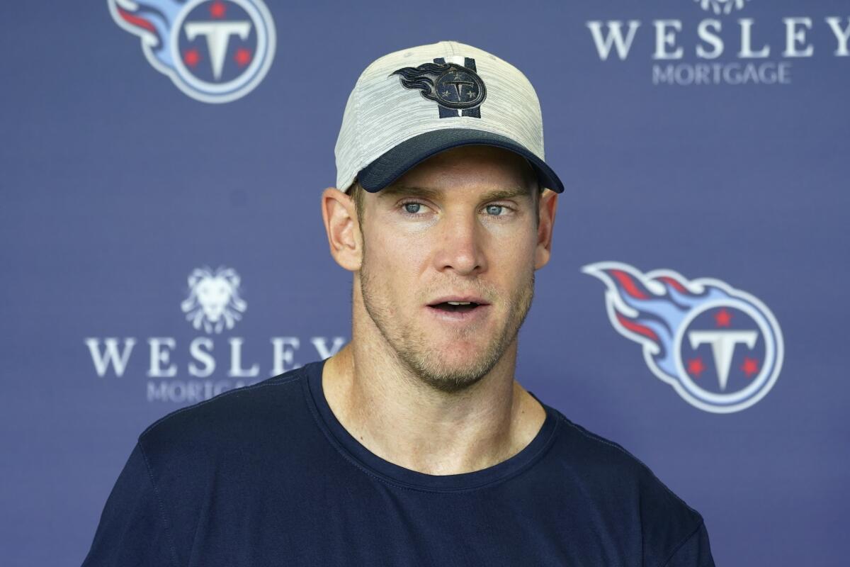 FILE - Tennessee Titans quarterback Ryan Tannehill answers questions after an NFL football training camp practice Wednesday, Aug. 24, 2022, in Nashville, Tenn. Tannehill didn't take even one snap in the preseason. The Tennessee quarterback now gets to take the first step Sunday against the New York Giants toward another chance at playoff redemption after the Titans' divisional home loss last January. (AP Photo/Mark Humphrey, File)
