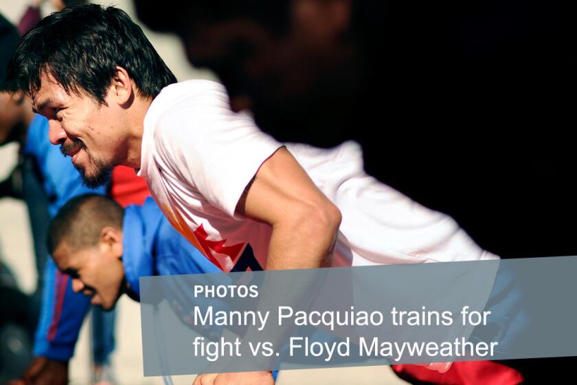 Boxer Manny Pacquiao does push-ups during a workout at a park in L.A. on April 2.