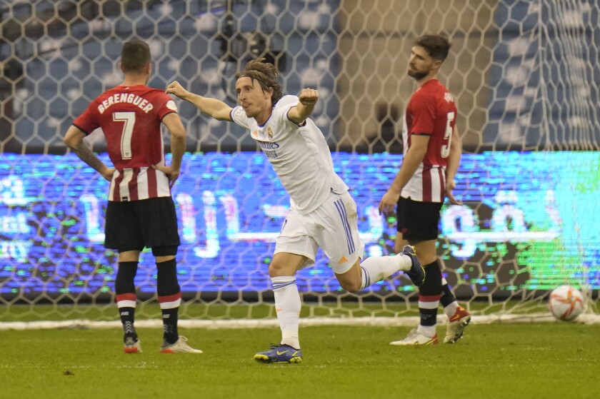 Real Madrid'd Luka Modric celebrates after he scored during the Spanish Super Cup final soccer match between Real Madrid and Athletic Bilbao at King Fahd stadium in Riyadh, Saudi Arabia, Sunday, Jan. 16, 2022. (AP Photo/Hassan Ammar)