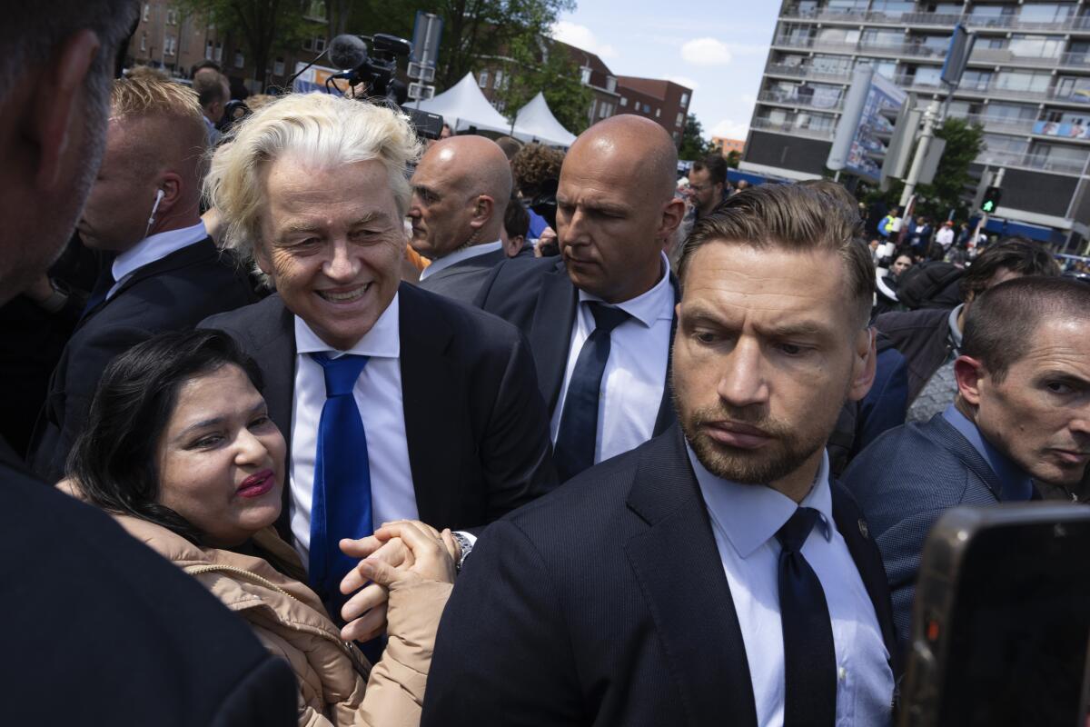 Lawmaker Geert Wilders walks amid a crowd.
