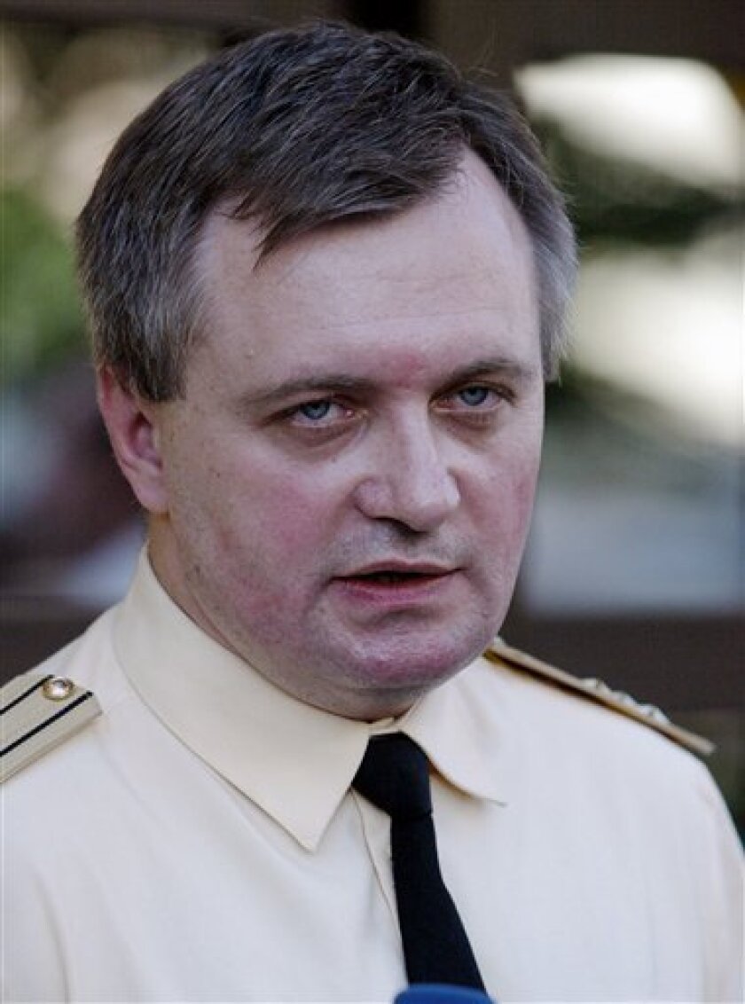 In this Aug. 5, 2005 file photo, Russian navy spokesman Capt. Igor Dygalo speaks to the media in Moscow about a mini-submarine trapped on sea floor off Kamchatka with 7 aboard. An accident aboard a nuclear-powered Russian navy submarine doing a test run in the Pacific Ocean killed more than 20 people Sunday Nov. 8, 2008, the navy said. The nuclear reactor aboard the submarine was operating normally and radiation levels were normal, Dygalo said. (AP Photo/Mikhail Metzel, File)