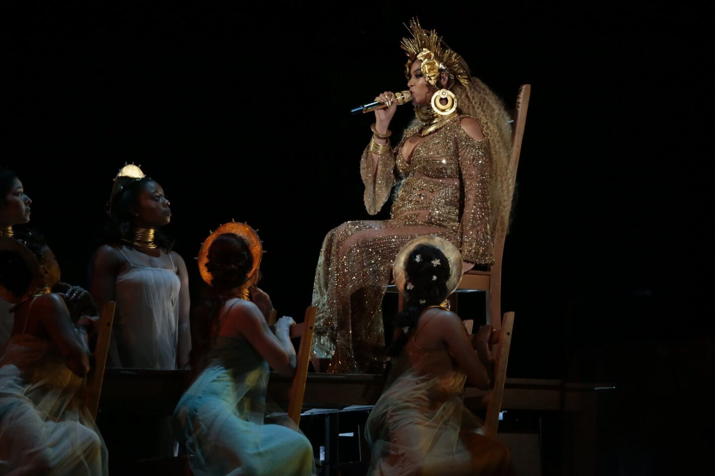 Beyoncé, on a throne, performs at the 59th Grammy Awards.