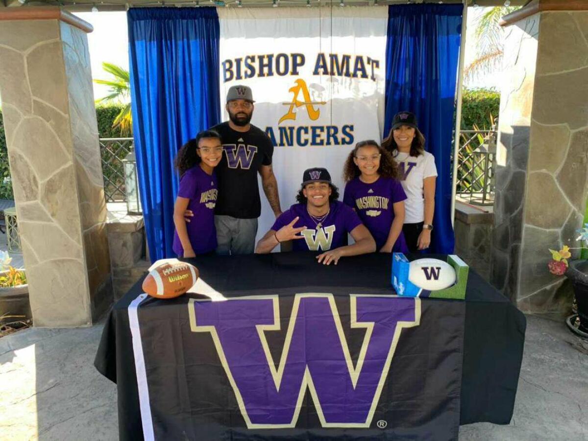 Bishop Amat's Dyson McCutcheon signs with Washington with father, Daylon, mother, Shawna, and sisters Shyanne and Maliyah.
