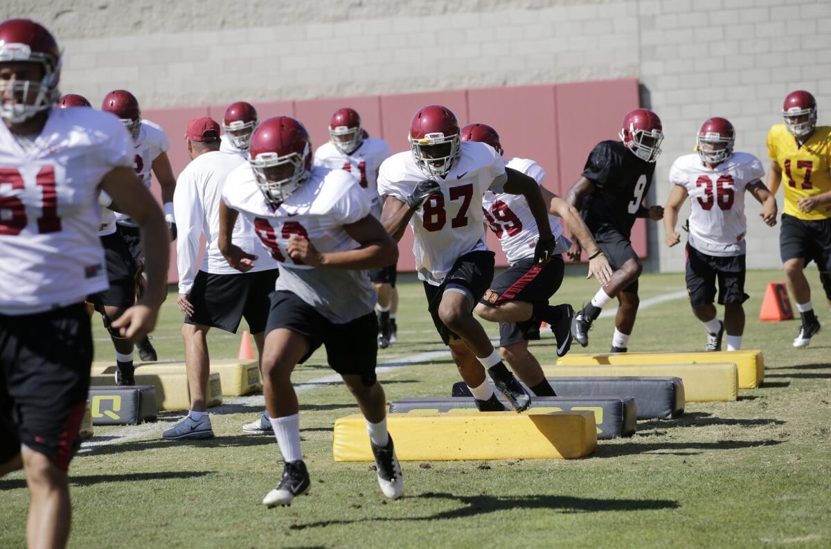 USC players run through drills during a practice session last week.
