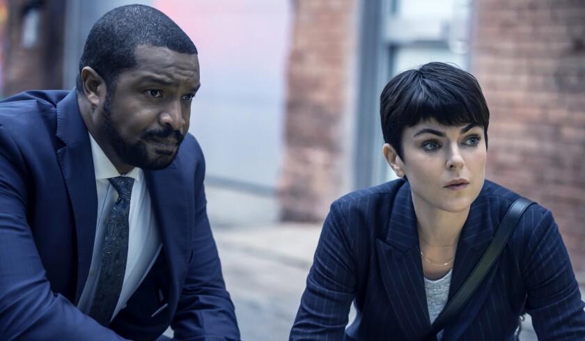 Roger Cross and Serinda Swan in "Coroner" on the CW.