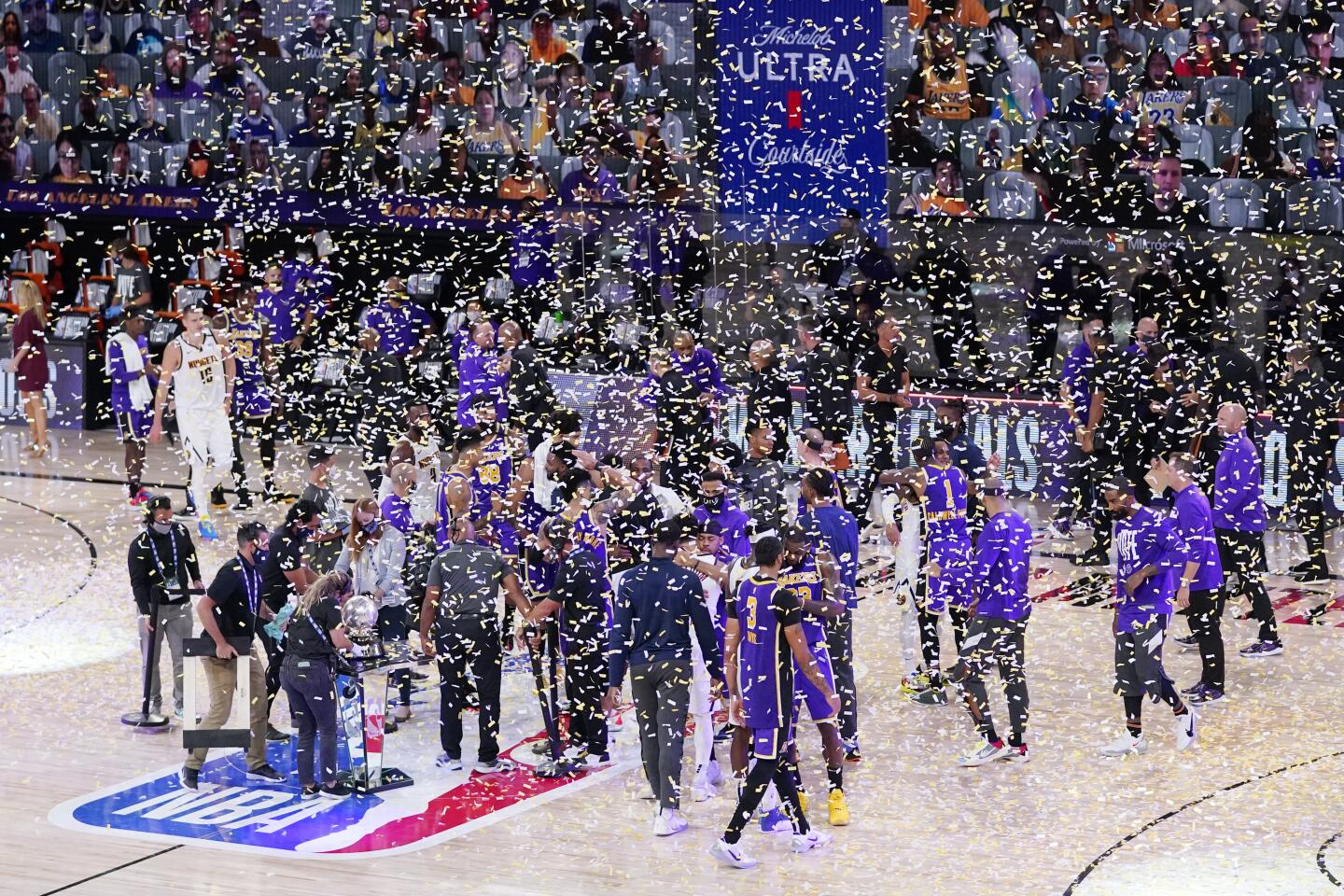 Confetti falls from the top of AdventHealth Arena as the Lakers celebrate their Western Conference finals series victory.