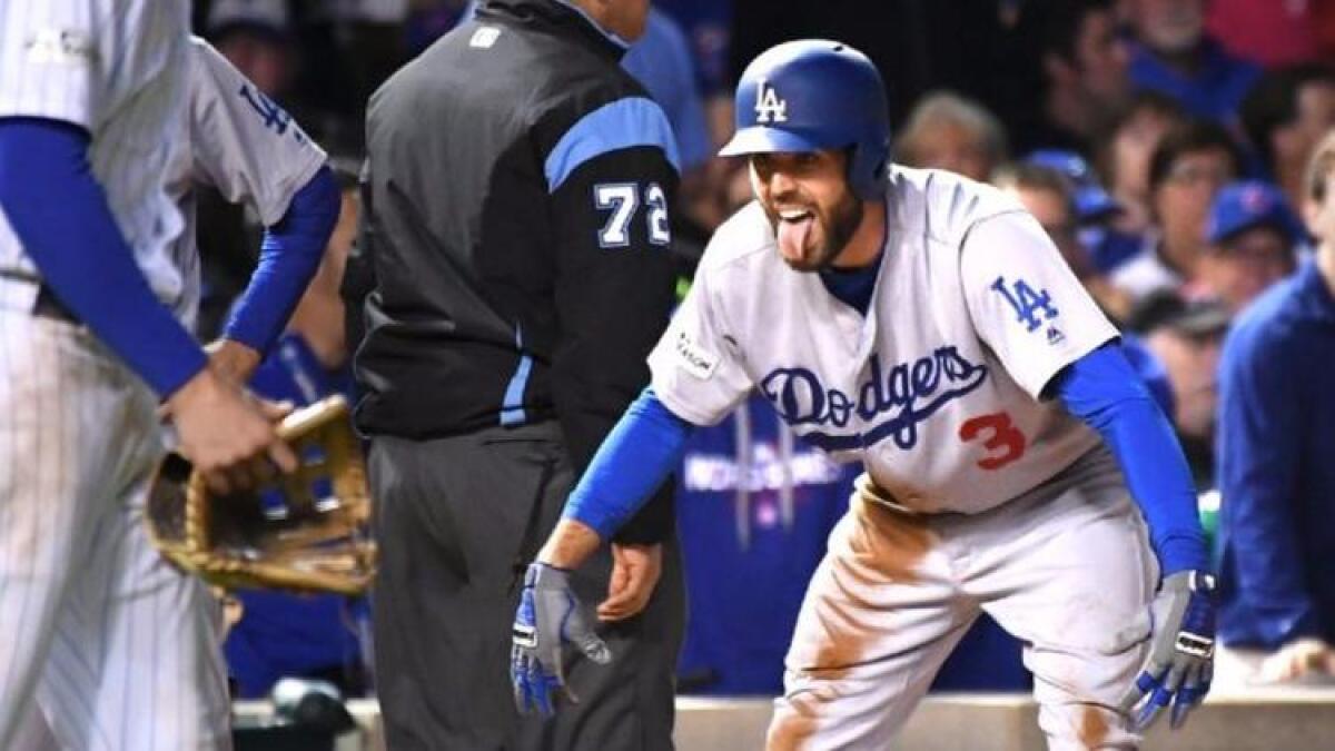 Chris Taylor celebrates his RBI triple in the fifth inning of NLCS Game 3.