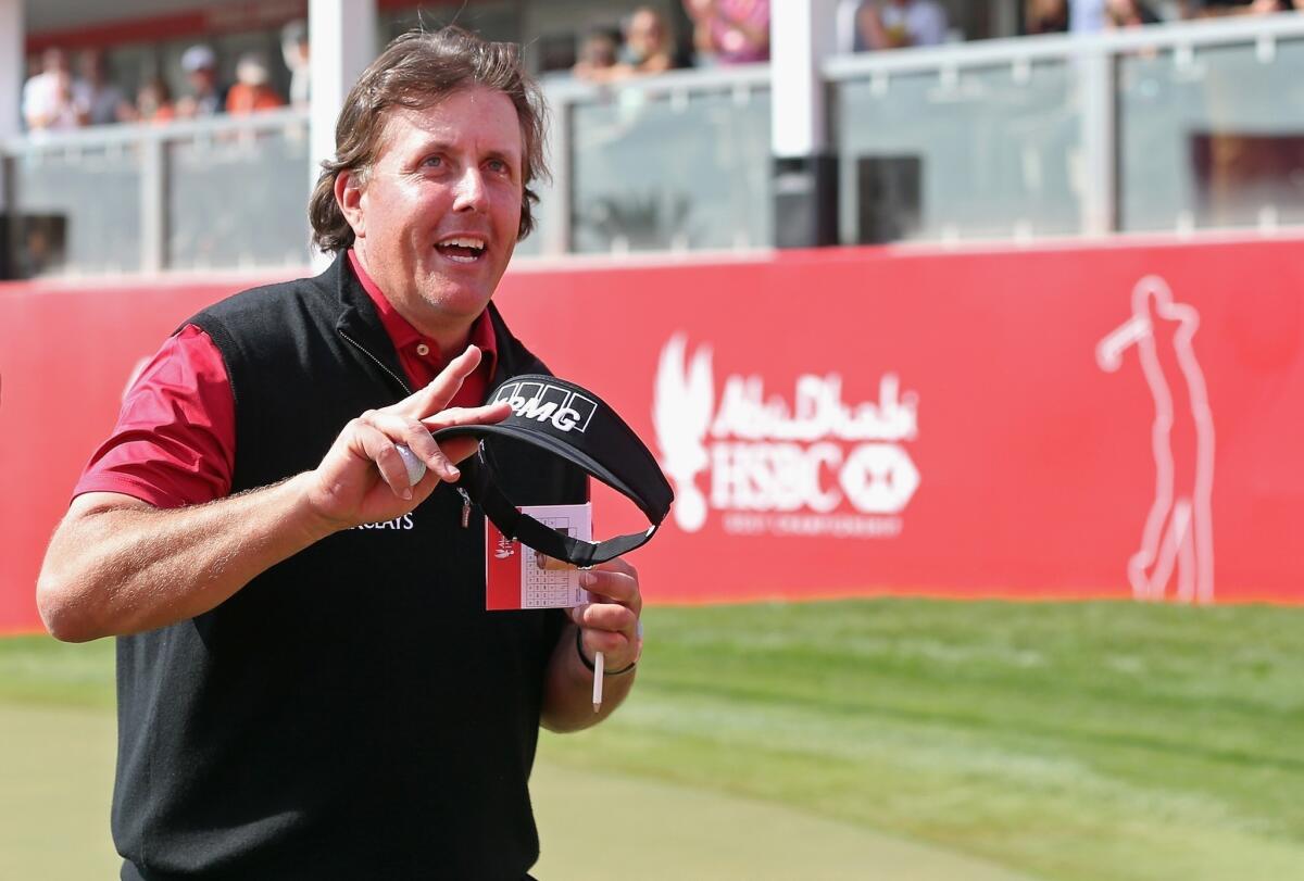 Phil Mickelson acknowledges the crowd after finishing the third round of the Abu Dhabi Championship on Saturday.