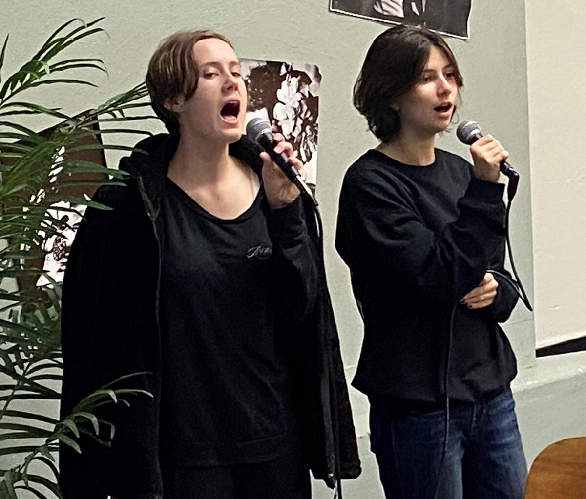 Senior vocalists Samantha Watts and Amaya Gray during a choir rehearsal.