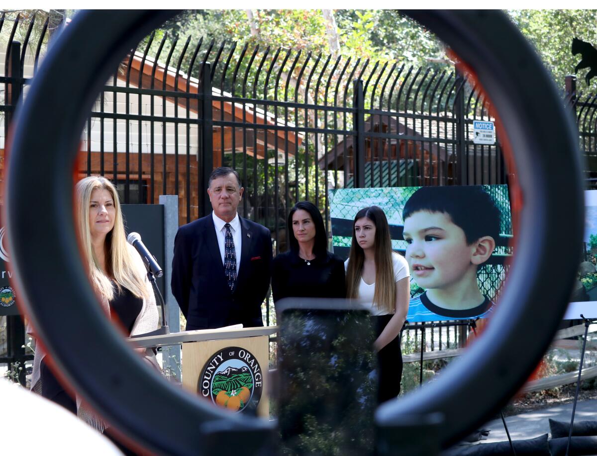 Carla Lacy speaks during during event discussing the plans to dedicate a plaque for Aiden Leos at the O.C. Zoo on Monday.