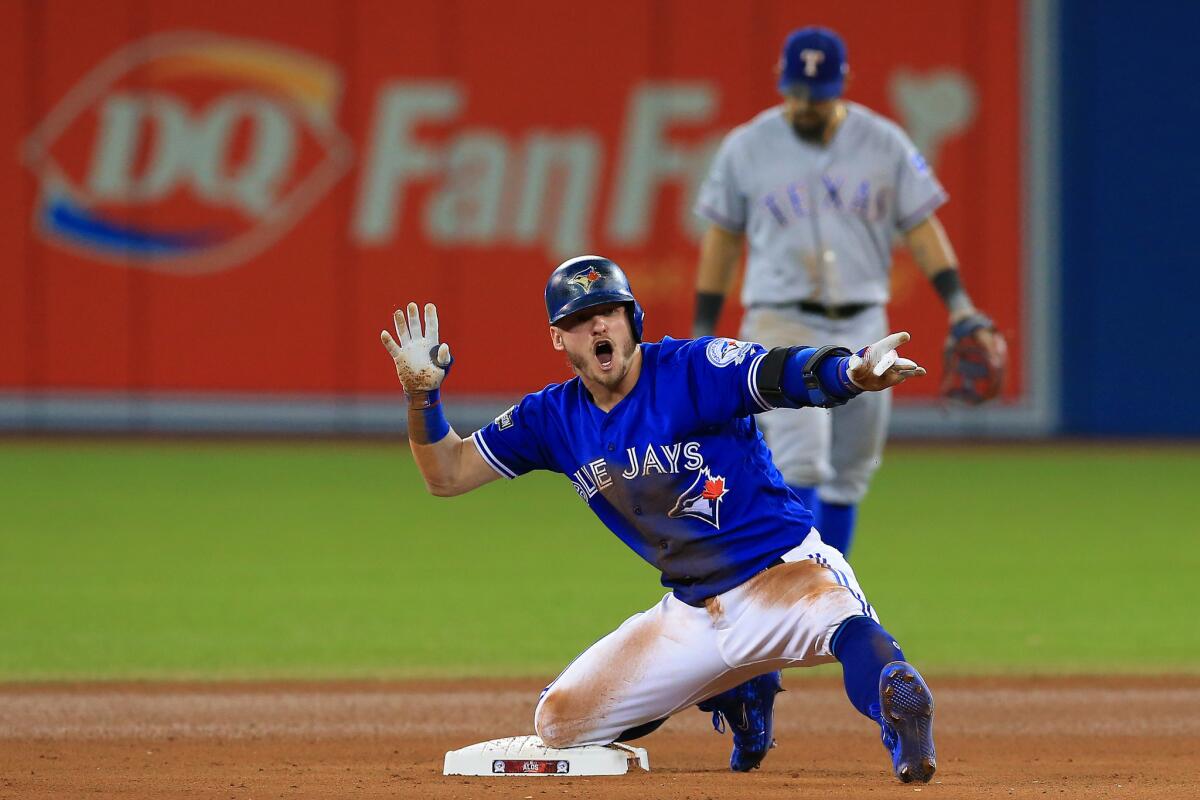 Blue Jays third baseman Josh Donaldson (20) reacts after hitting a double in the tenth inning. He scored the game-winning run later in the inning to