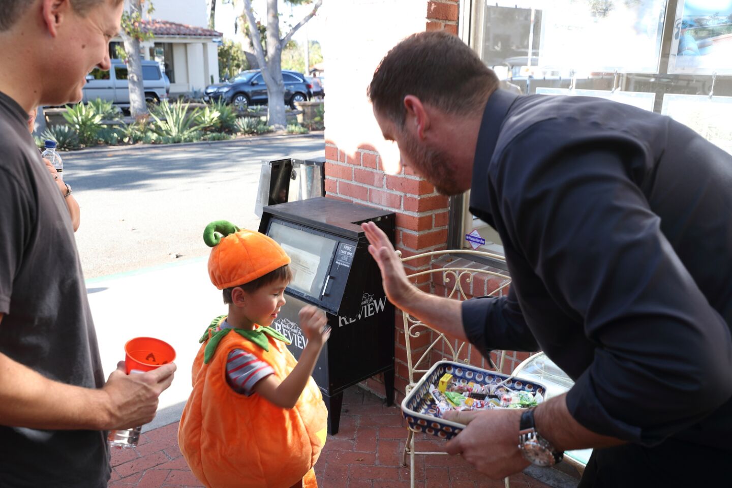 Jake Moore stopped to get candy from Matt Palmquist at RSF Escrow