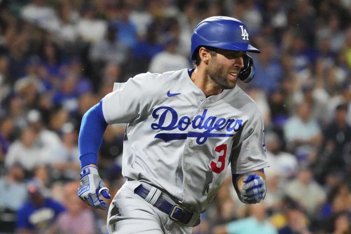 Dodgers left fielder Chris Taylor runs to first against the Colorado Rockies on June 28.