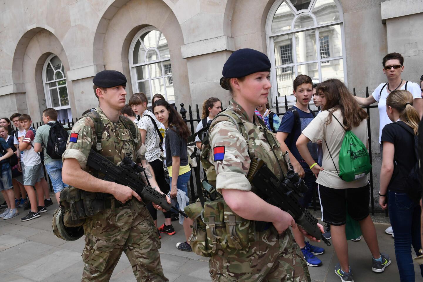 British Army soldiers patrol along Whitehall near Downing Street and the Houses of Parliament in central London on May 24, 2017.
