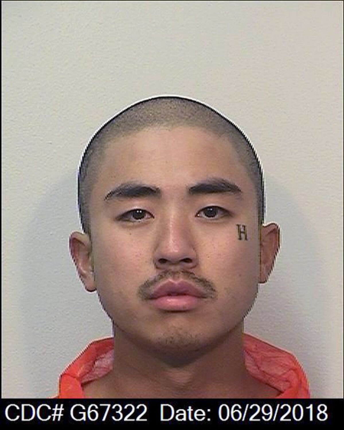 This June 29, 2018 booking photo released by the California Department of Corrections and Rehabilitation, CDRC, shows inmate Sidney Kang. Kern Valley State Prison (KVSP) officials are investigating the death of Sidney Kang as a homicide after he was attacked by two other incarcerated men in Delano, Calif. On Thursday, May 5, 2022 officers responded when inmates Anthony Ramirez and Michael Caldera allegedly attacked Kang on a maximum-security recreational yard.(California Department of Corrections and Rehabilitation via AP)