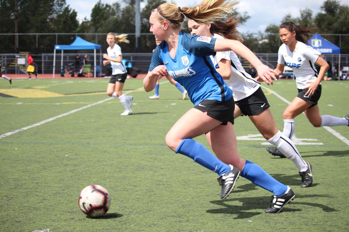 Brielle Benedict dribbles the ball up the field in a girls' soccer match for the Pateadores under-15 team against the San Diego Surf on March 9, 2019.
