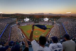 LOS ANGELES, CALIF. --WEDNESDAY, OCT. 25, 2017: Dodgers fans wave souvenir towels.