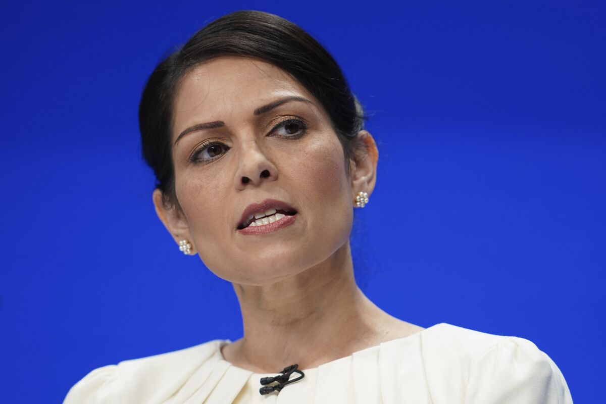 FILE - Britain's Home Secretary Priti Patel speaks at the Conservative Party Conference in Manchester, England, Tuesday, Oct. 5, 2021. The British government apologized for delays but defended its Ukraine refugee policy on Friday, April 8, 2022 after figures showed only 12,000 Ukrainians fleeing the war have arrived in the U.K. (AP Photo/Jon Super, File)