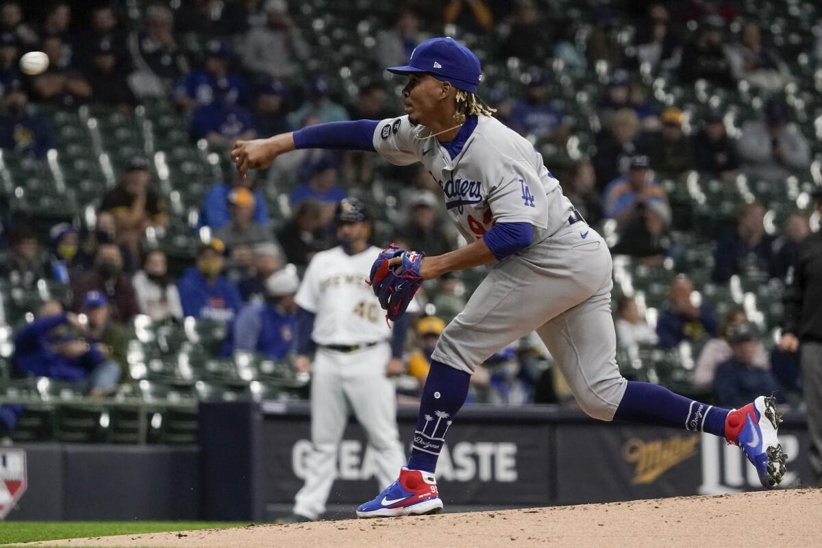 Dodgers pitcher Edwin Uceta delivers against the Brewers in the first inning Friday.